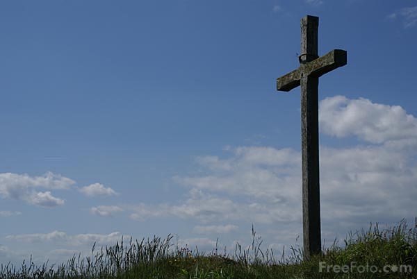 Picture of a wooden Christian cross on Saint Cuthberts Isle, Holy Island, Northumberland. St Cuthberts Isle was a small island used as a retreat by both Aidan and Cuthbert.