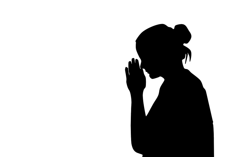 praying woman silhouette