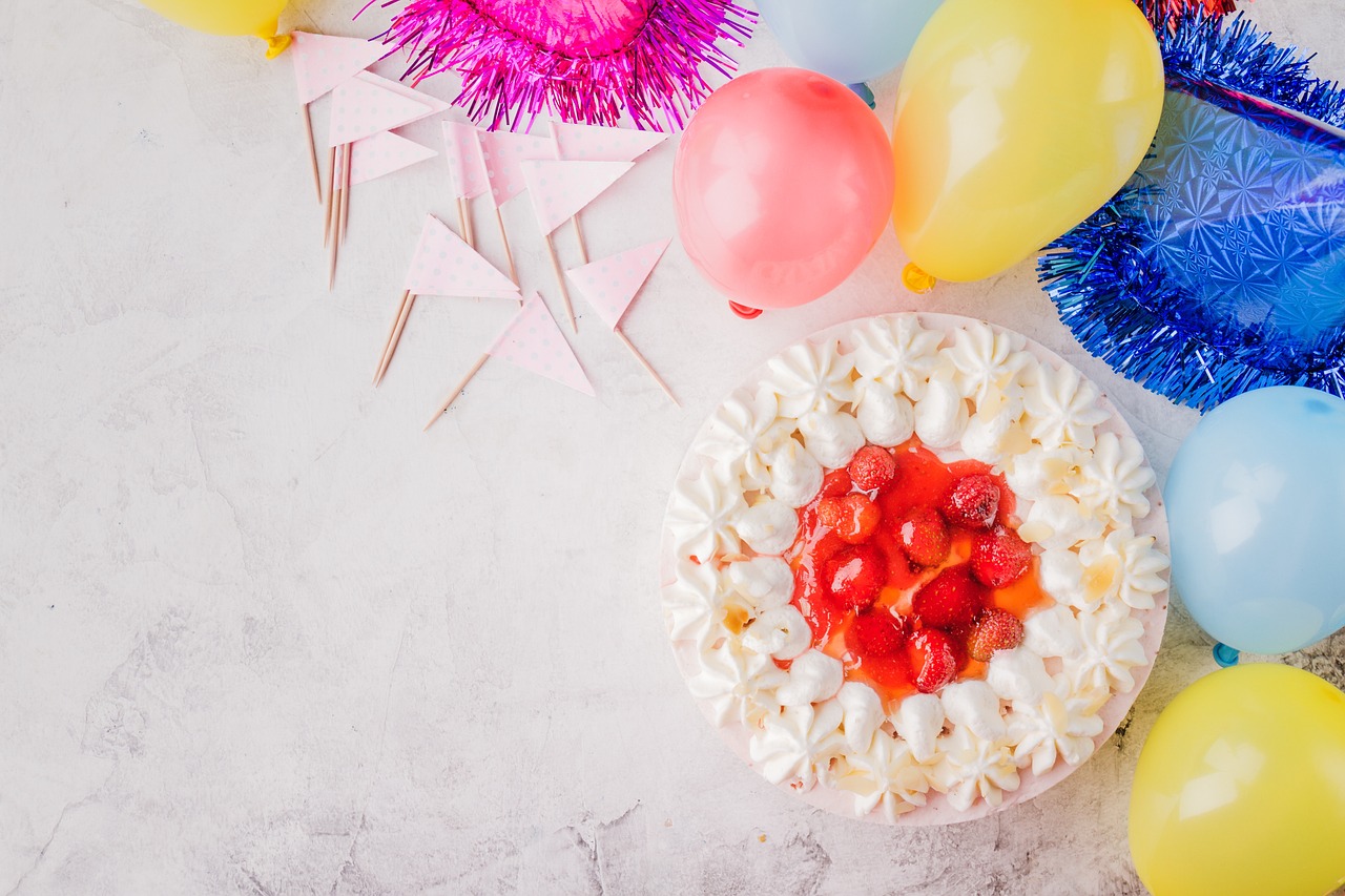 Image of birthday cake surrounded by balloons. Celebration. 