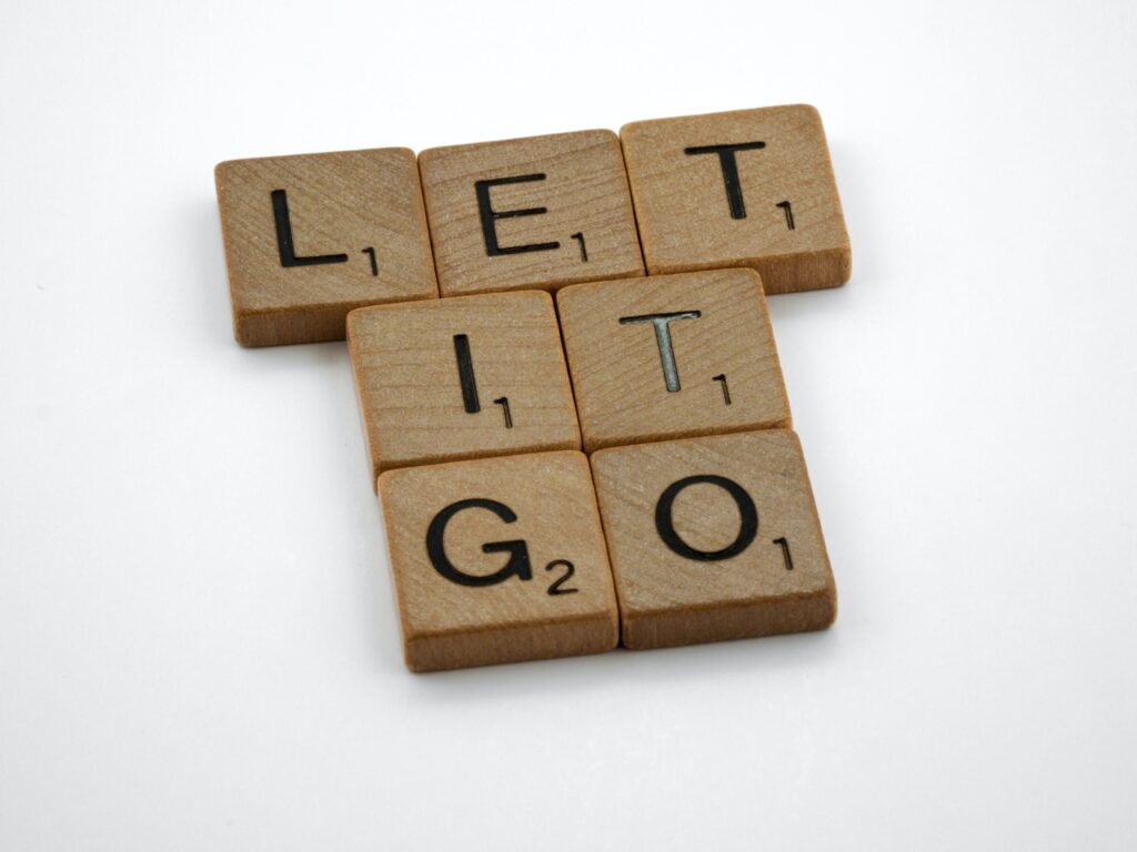 Scrabble tiles spelling 'Let It Go'