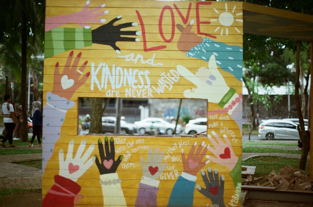 Poster board of various colors, Love and Kindness are never wasted, in a city park