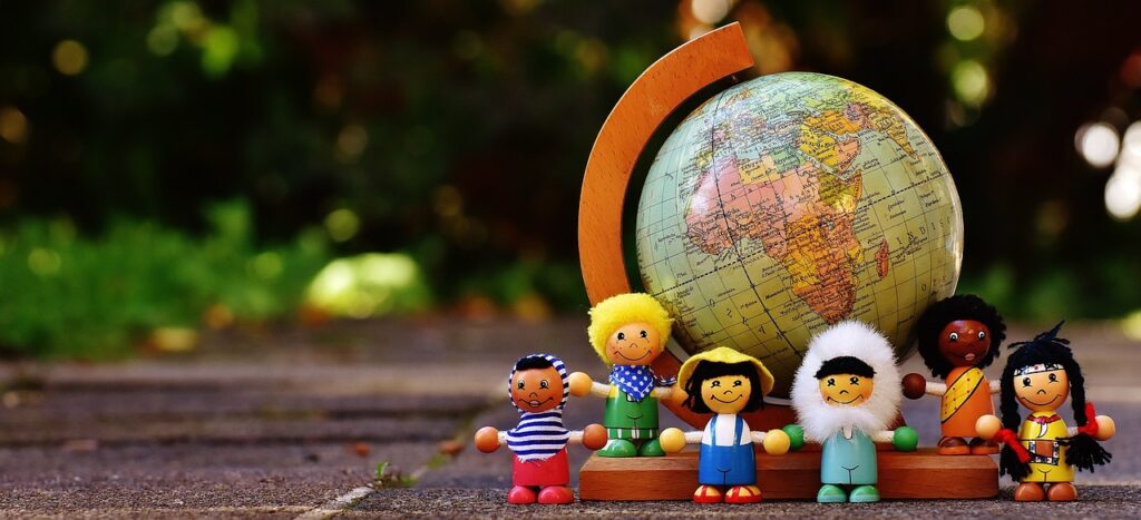 different nationalities of children, globe in the background