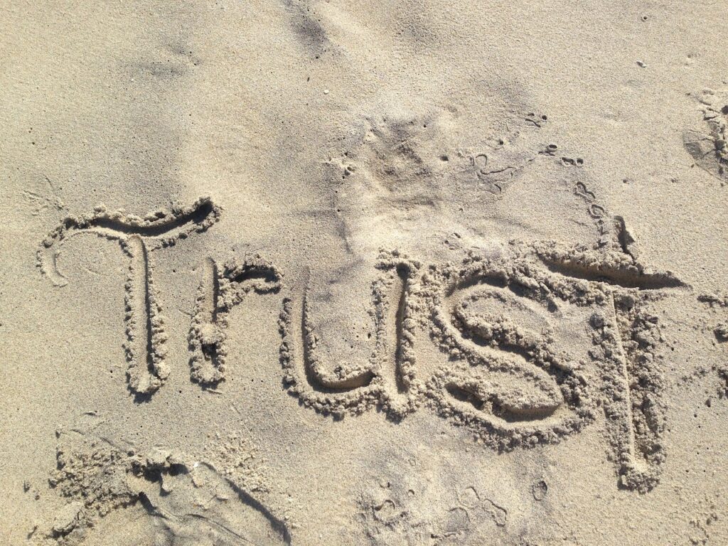 trust-1418901_1280 Trust word in the sand