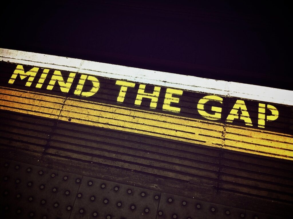mind-the-gap-1876790_1280 Black background with gold letters 'Mind the Gap'