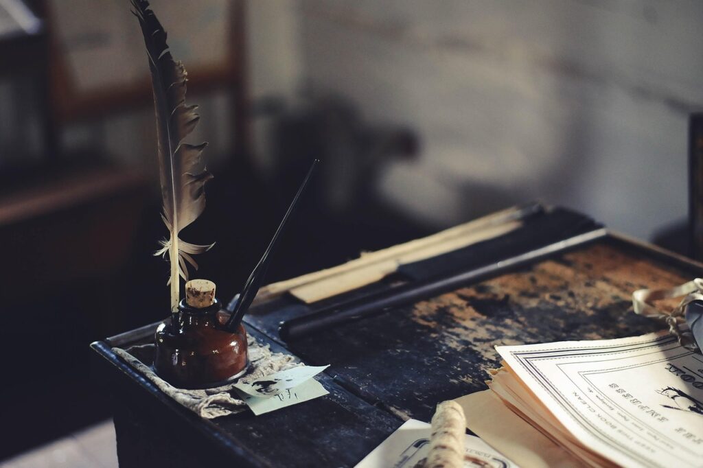 writing desk-1869579_1280 image of ink well and wooden writing desk