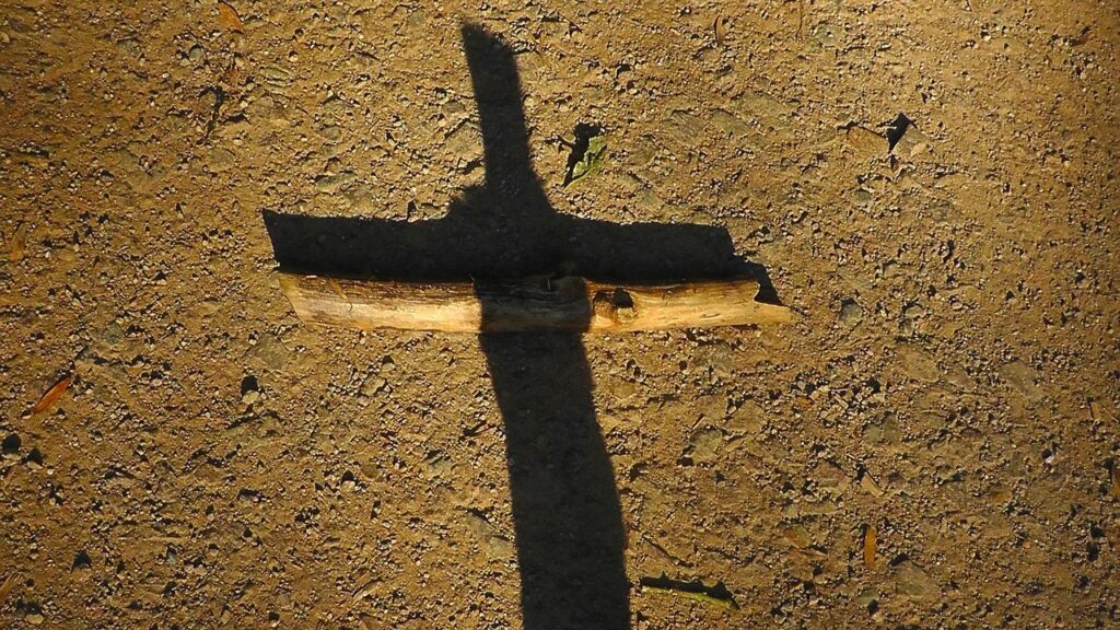 cross wooden beam with shadow forming a cross
