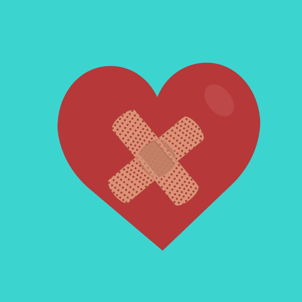 red heart with bandage in the center